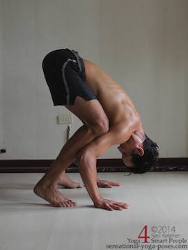 crow pose with head down and looking back. Neil Keleher. Sensational Yoga Poses.