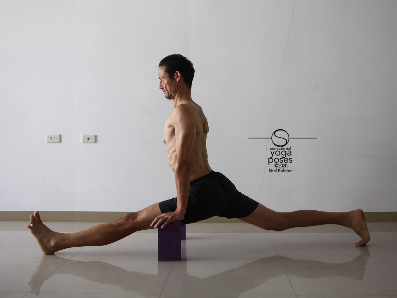 Front to back splits with torso upright and back foot toes tucked and back knee lifted. Neil Keleher, Sensational Yoga Poses.