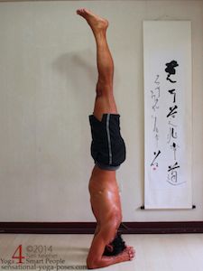 bound headstand, yoga pose, to balance in bound headstand, the elbows and crown of the head form a triangle and there is even pressure between elbows and head.