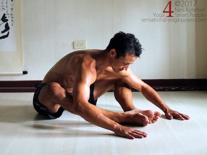 Bound angle forward bend for the hips with feet forwards, away from the pelvis. Neil Keleher. Sensational Yoga Poses.