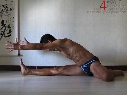 Bending towards the straight leg with hands lifted and reaching forwards. Neil Keleher. Sensational Yoga Poses.