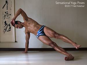 Balancing in side plank with bottom knee and elbow straight and with top leg lifted. Neil Keleher, Sensational Yoga Poses.