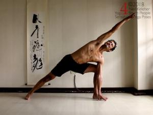 Side angle pose Standing yoga poses: side angle pose with one knee straight and the other knee bent, bent knee han is touching the floor, straight leg arm is reaching past the head, both elbows are straight. Neil Keleher, sensational yoga poses.