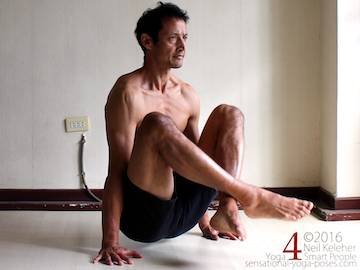 Dangle pose with shoulder blades depressed.  Neil Keleher. Sensational Yoga Poses.