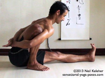 Marichyasana a pose, a seated forward bend with the bend knee bound by the arms. Neil Keleher. Sensational Yoga Poses.