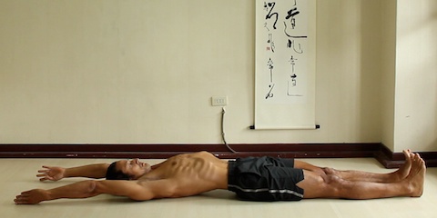 reclining psoas stretch with both arms reaching back. Reclining mountain pose.