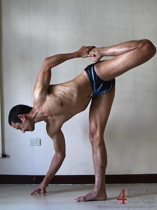 Standing quadriceps and hamstrings stretch, one reason to get more flexible. Neil Keleher. Sensational Yoga Poses.