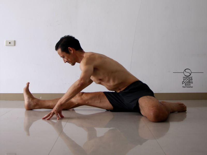 Hurdlers stretch bending forwards with hands on floor. Neil Keleher, Sensational Yoga Poses.