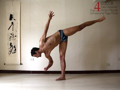 Half moon yog pose with elbow bent to lift hand. Neil Keleher. Sensational Yoga Poses.