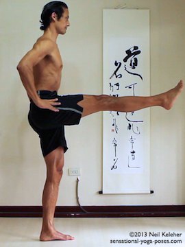 Sensational Yoga Poses, Model Neil Keleher. balancing on one leg in utthitta hasta padangusthasan with leg to the front and both hands on the waist.