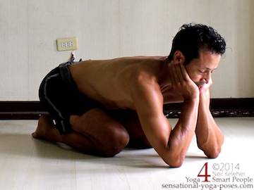 child pose variation with elbow on the floor and hands supporting the chin (for low back pain)