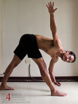 Yoga poses for abs, triangle twist with bottom hand lifted using abs to twist ribcage, neil keleher, sensational yoga poses.