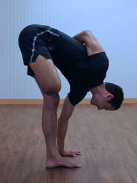 Half Bound lotus, standing forward bend. Neil Keleher, Sensational Yoga Poses.