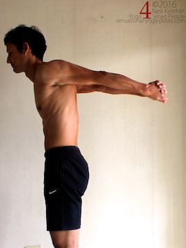 Hands clasped and arms stretching back from down position, neil keleher, sensational yoga poses.