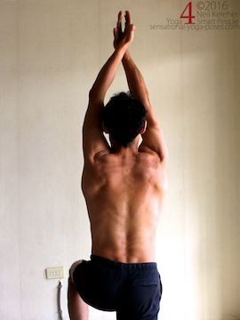 Arm overhead shoulder stretch, pulling hands apart to add tension, neil keleher, sensational yoga poses.
