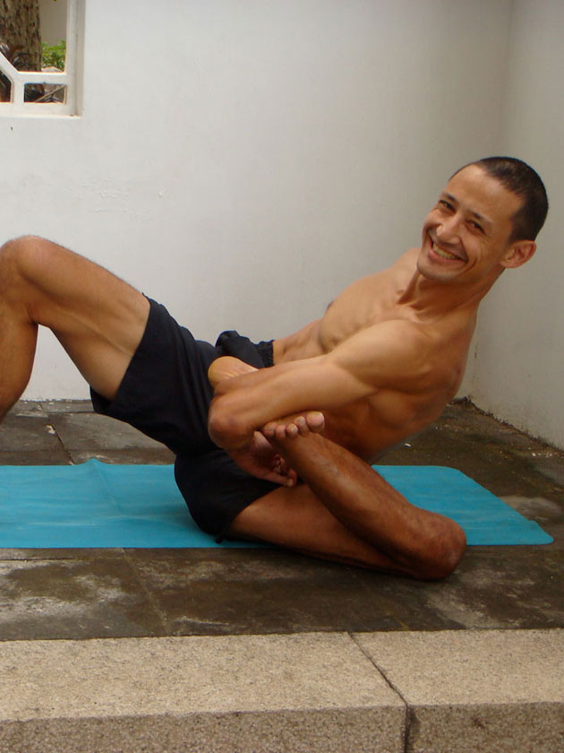 Arm pit pose, a binding pose with the foot near the armpit. Neil Keleher, Sensational Yoga Poses.