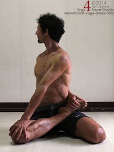 bharadvajasana, a twisting yoga pose with one leg in the yoga lotus position and the other leg in hero or virasana. Neil Keleher. Sensational Yoga Poses