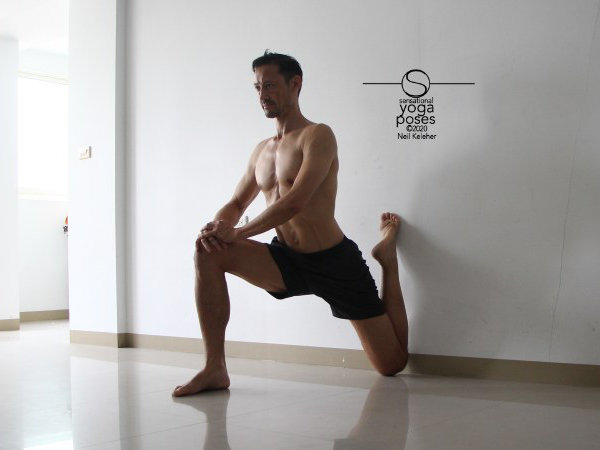 quad stretch using a wall with hips forwards and torso upright. Neil Keleher, Sensational Yoga Poses.