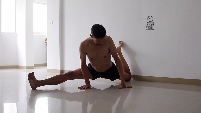 quad stretch using a wall, splits variation. Neil Keleher, Sensational Yoga Poses.