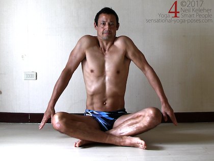 Scapular elevations while sitting cross legged. Neil Keleher. Sensational Yoga Poses.