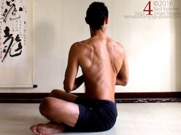 Yoga poses for abs, seated twist with hands in prayer and using abs to turn ribcage relative to pelvis, neil keleher, sensational yoga poses.