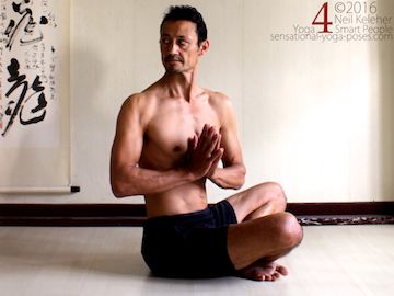 Yoga poses for abs, seated twist with hands in prayer and using abs to turn ribcage relative to pelvis, neil keleher, sensational yoga poses.