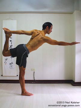 Sensational Yoga Poses, Model Neil Keleher. Balancing on one foot while upright in dance pose or or standing bow with the same side hand grabbing the lifted foot behind the body.