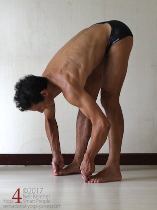 Arm strengthening standing forward bend:  Grabbing the big toes and pulling. Neil Keleher. Sensational Yoga Poses.