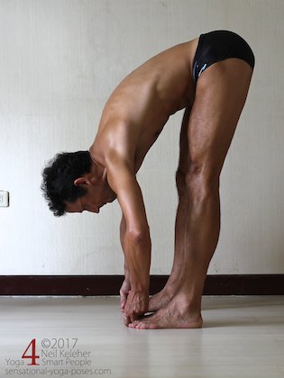 Arm strengthening standing forward bend: Grabbing the big toes and pulling. Neil Keleher. Sensational Yoga Poses.