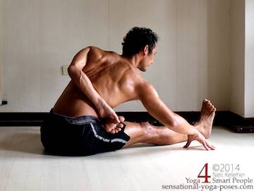 half bound lotus seated forward bend (ardha baddha padmo paschimottanasana). Right foot is in lotus and bound with the right hand. Left hand is grabbing the left big toe. Torso is tilted forwards at the hips. Neil Keleher. Sensational Yoga Poses.