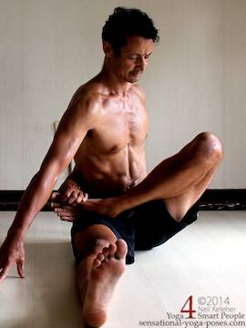 Half bound yoga lotus with the lotus knee lifted. Neil Keleher. Sensational Yoga Poses.