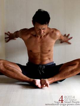 bound angle in front of a wall using hands against the wall to help make leaning forward easier. Neil Keleher. Sensational Yoga Poses.