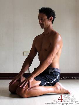 the yoga kneeling posture called hero pose, virasana (kneeling with bum between the feet while upright.) 