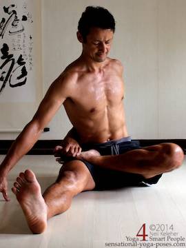 yoga lotus, one leg in lotus, bound, other leg straight with torso upright, lotus knee off of the floor. Neil Keleher, Sensaitonal Yoga Poses.