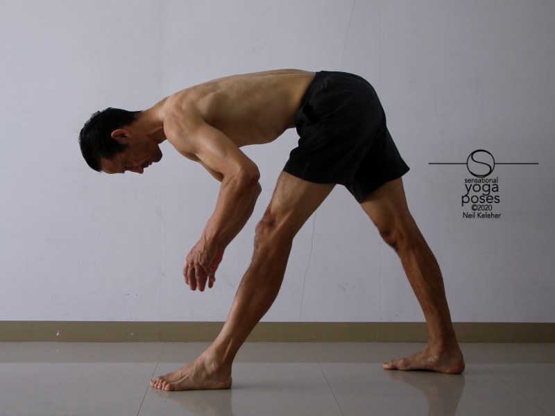 Pyramid pose with hands lifted and hamstrings activated. Neil Keleher, Sensational Yoga Poses.