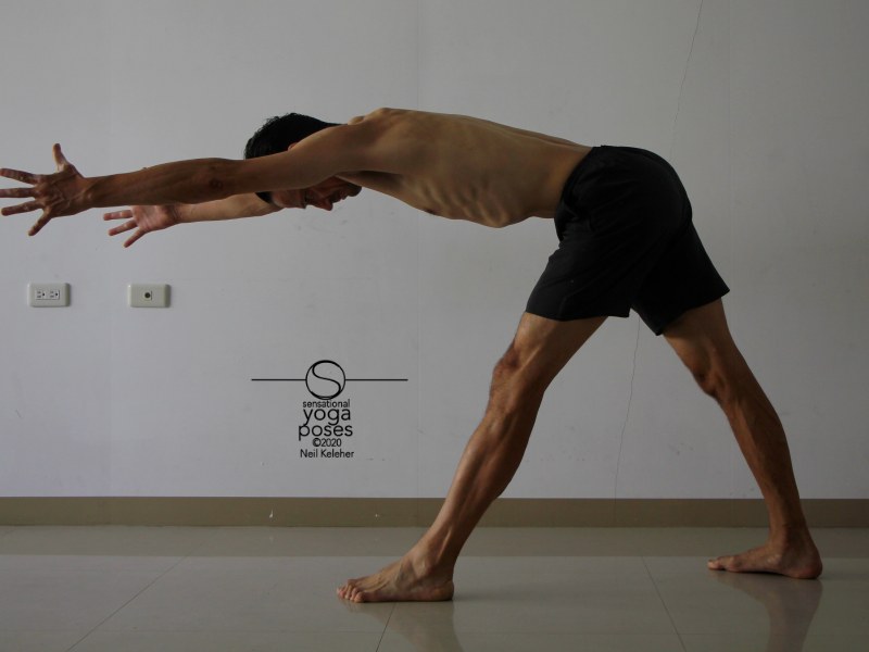 Pyramid pose with hands reaching forwards and hamstrings activated. Neil Keleher, Sensational Yoga Poses.