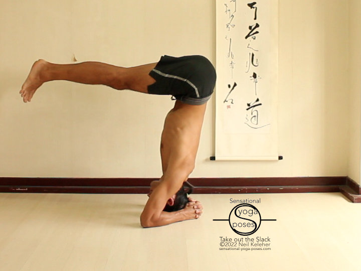 Lifting into headstand with knees straight Lifting into headstand with knees straight, your hips will move back as your legs move towards horizontal. Feel your center of gravity using your elbows and the crown of your head.
