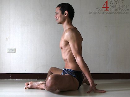 Bound angle pose sitting upright with arms behind for support, Neil Keleher. Sensational Yoga Poses.