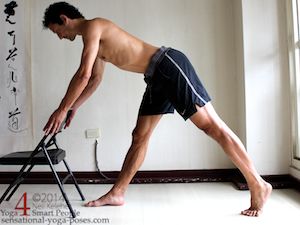 hamstring stretches using a chair for support.