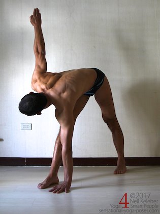 Knee strengthening exercises: twisting triangle with knees engaged. Neil Keleher, sensational yoga poses.