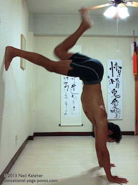 swing a leg up while doing l shaped handstand using a wall, Neil Keleher, Sensational Yoga Poses