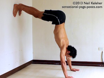 inverted yoga poses, L shaped handstand using wall. In this picture of L shaped handstand my shoulders and upper body aren't quite vertical. The intent is to use this pose to get used to being upside down, not to vertically stack the hands and torso