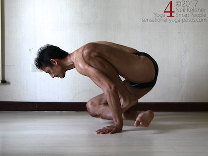 Lifting up from marichyasana a and moving the bottom foot back between the hands. Neil Keleher. Sensational Yoga Poses.