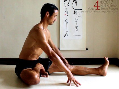 Janu sirsasana C, positioning the foot prior to bending forwards. Neil Keleher. Sensational Yoga Poses.