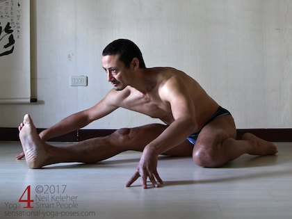 Half hero pose, a seated yoga pose with the shin of one leg folded to the outside of the thigh (kneeling). Neil Keleher. Sensational Yoga Poses.
