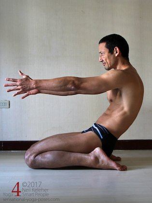 Kneeling with hips between feet (virasana yoga pose) with back bend forwards and arms reaching forwards. Neil Keleher. Sensational Yoga Poses.