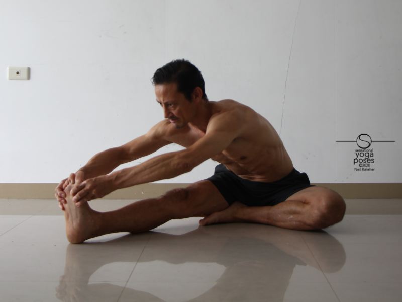 Janu sirsasana A grabbing the foot Neil Keleher, Sensational Yoga Poses.