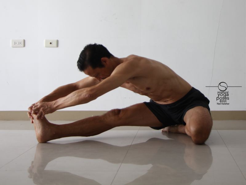 Janusirsasana b holding foot with both hands. Neil Keleher, Sensational Yoga Poses.