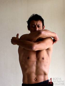 Outer shoulder stretch, crossing arms in front of chest with elbows bent, neil keleher, sensational yoga poses.