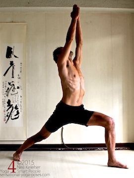 warrior 1 yoga pose, arms lifted, using serratus anterior to spread shoulder blades